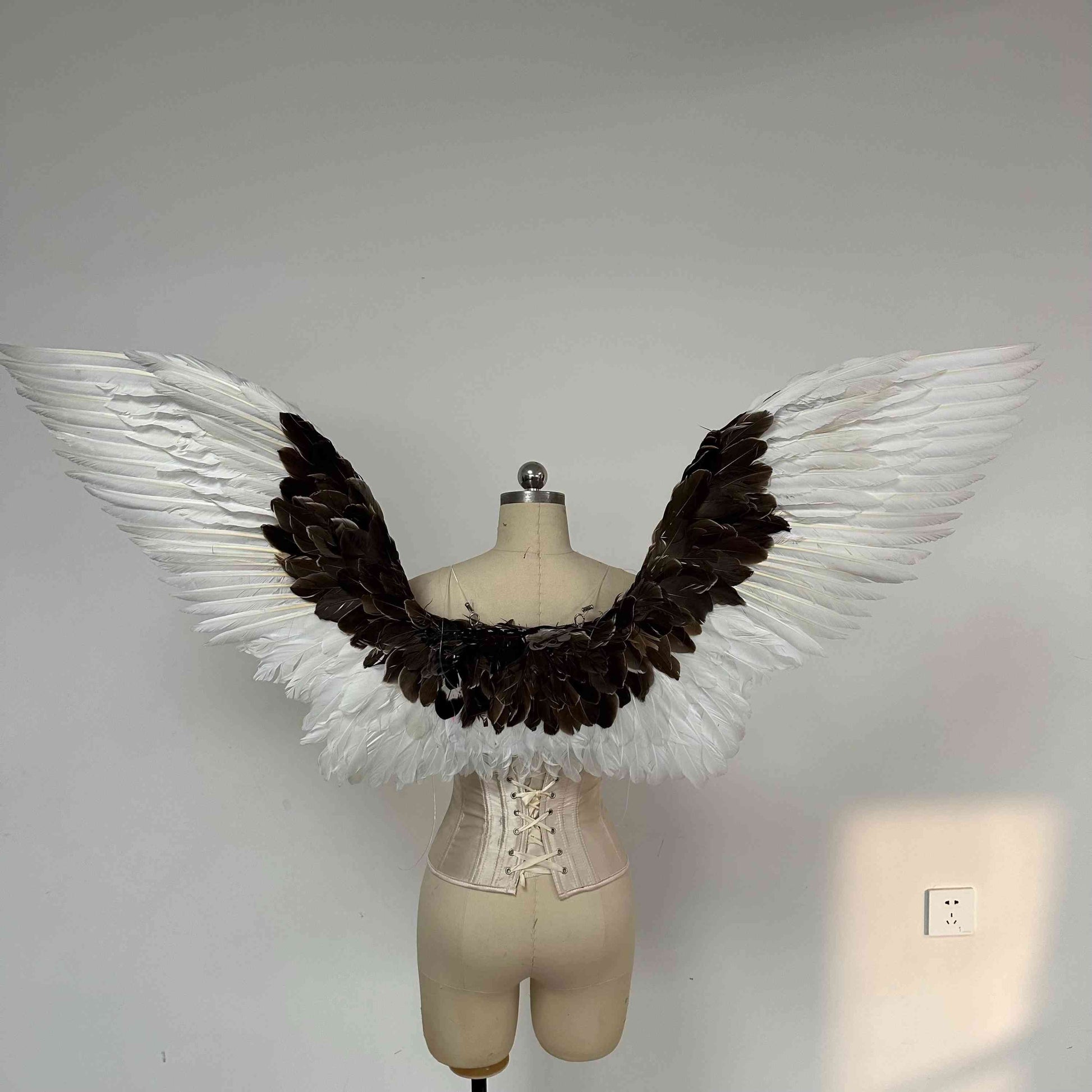 Our white gray angel wings from the back. Made from goose feathers. Wings for angel wings costume. Suitable for photoshoots.