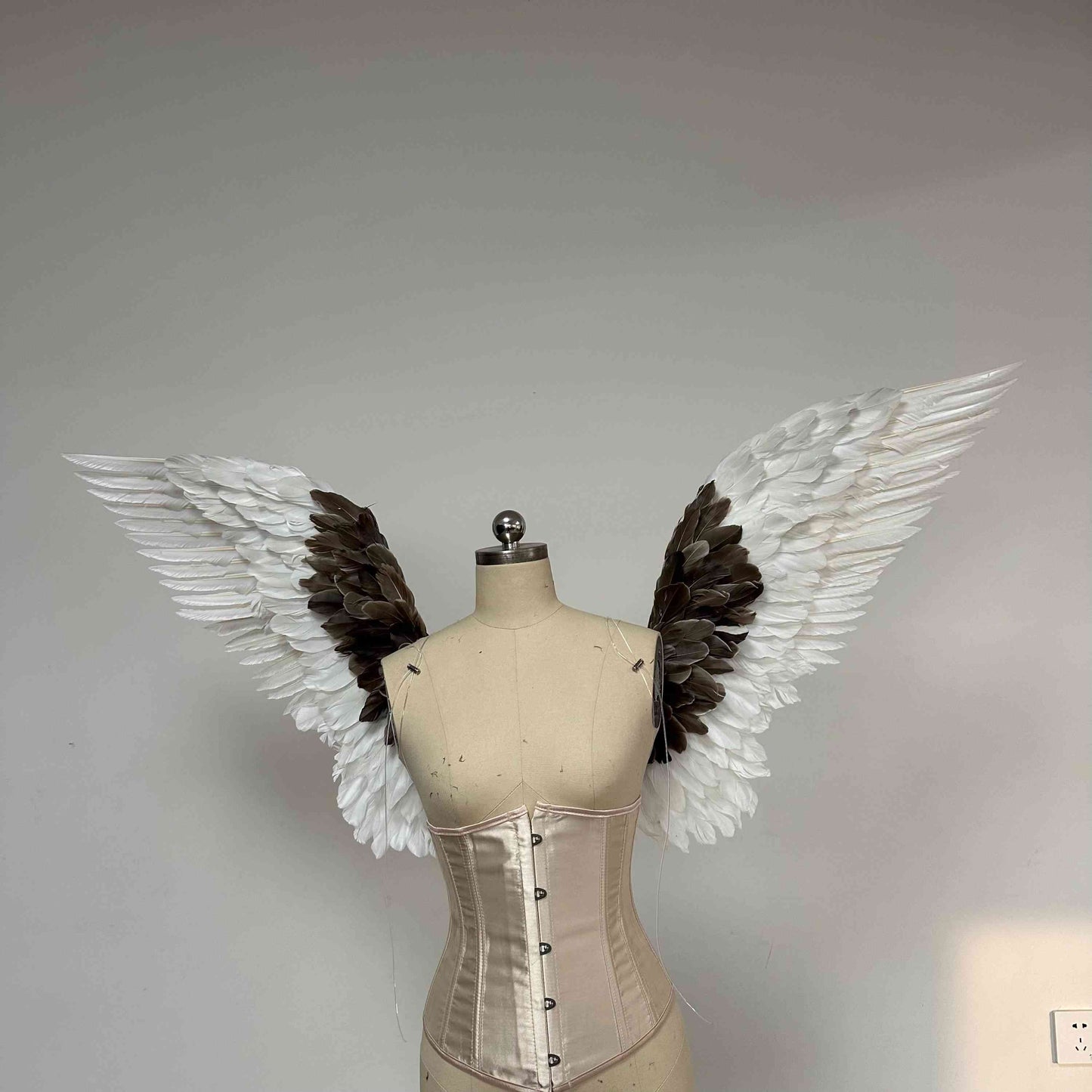 Our white gray angel wings from the front. Made from goose feathers. Wings for angel wings costume. Suitable for photoshoots.