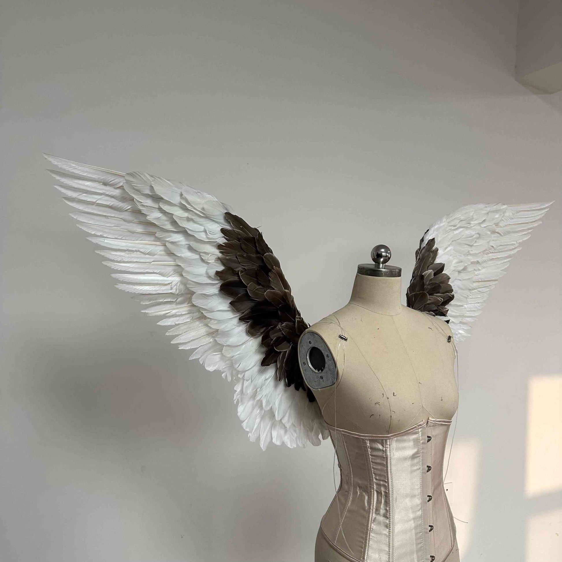 Our white gray angel wings from the right side. Made from goose feathers. Wings for angel wings costume. Suitable for photoshoots.