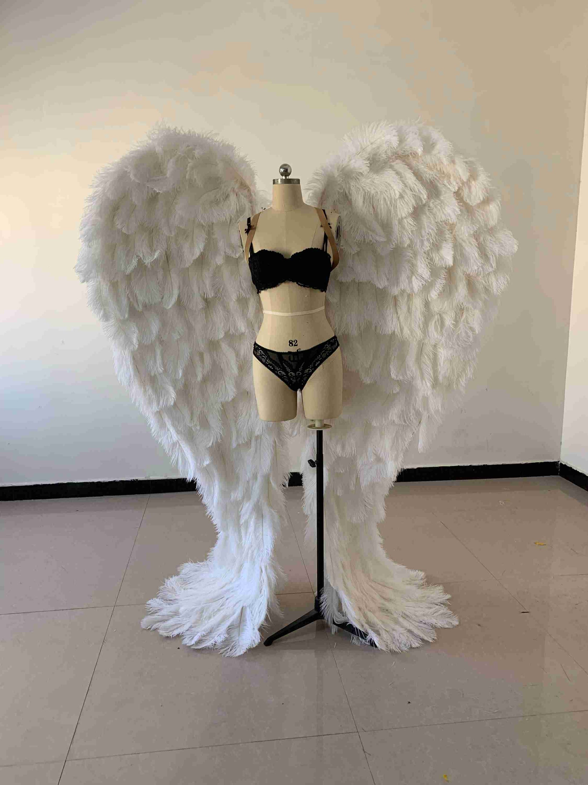 Our luxury white angel wings from the front. Made from ostrich feathers. Wings for angel costume. Suitable for photoshoots especially for boudoirs.