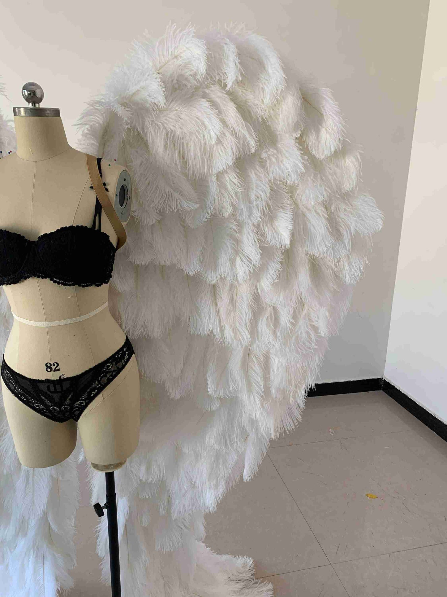 Our luxury white angel wings from the close view. Made from ostrich feathers. Wings for angel costume. Suitable for photoshoots especially for boudoirs.