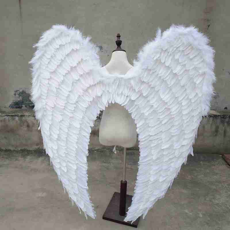 Our white angel wings from the back. Made from goose feathers. Wings for angel costume. Suitable for photoshoots.