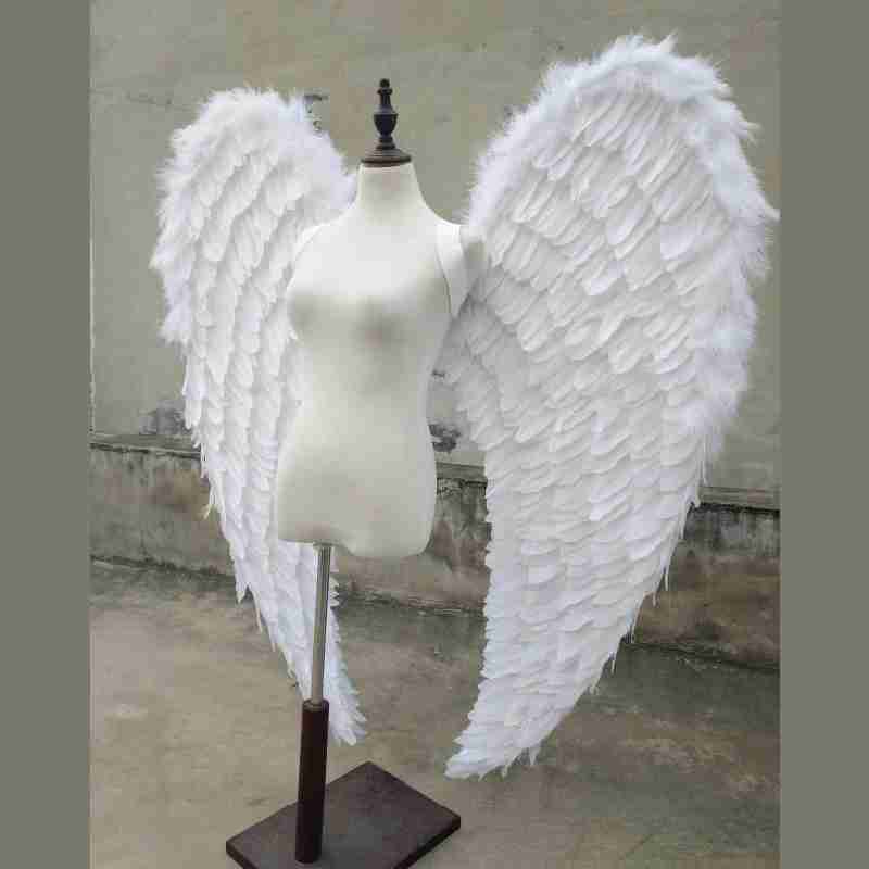 Our white angel wings from the left side. Made from goose feathers. Wings for angel costume. Suitable for photoshoots.