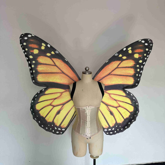 Our yellow black butterfly wings from the front. Made from cloth. Can be also named fairy wings or pixie wings.