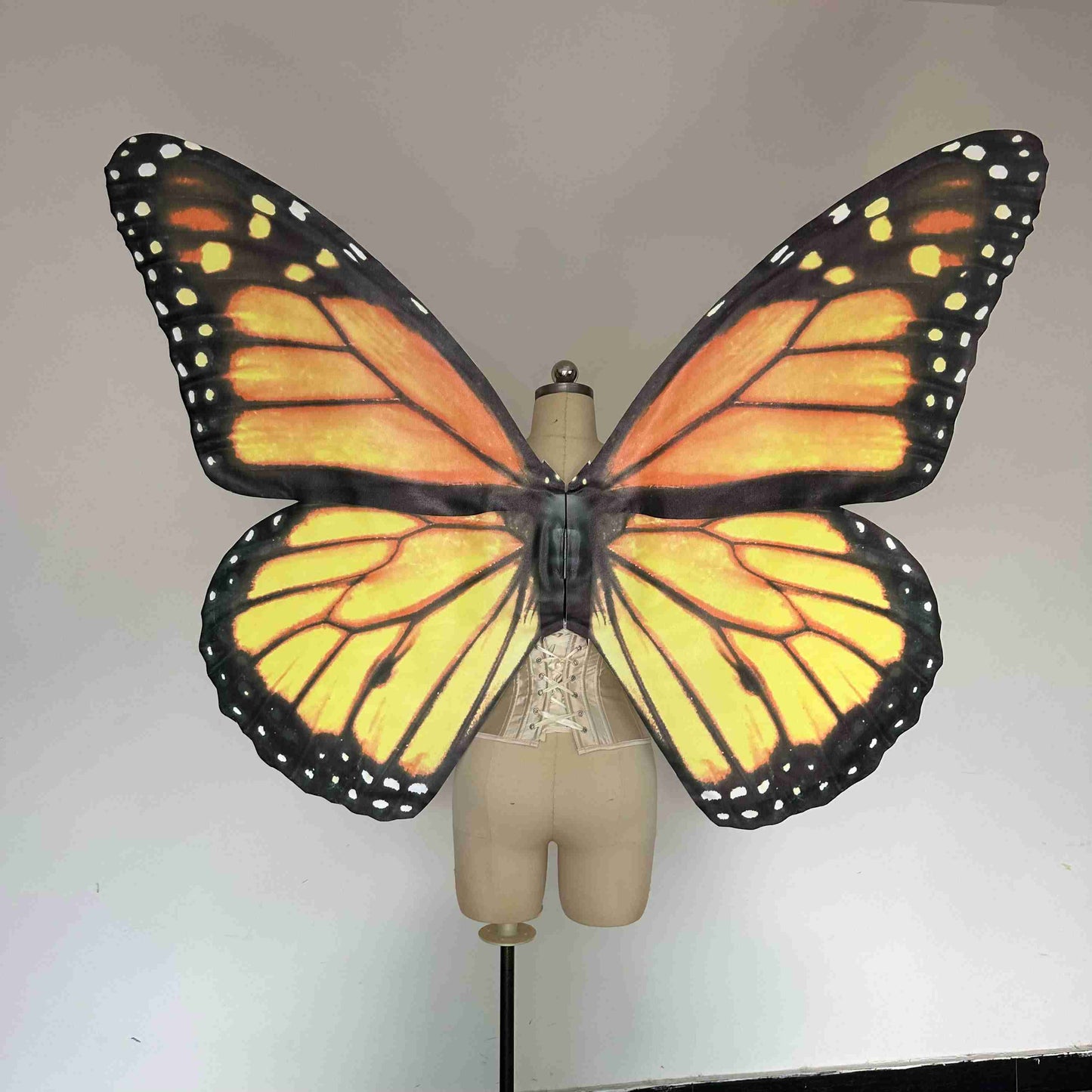 Our yellow black butterfly wings from the back. Made from cloth. Can be also named fairy wings or pixie wings.
